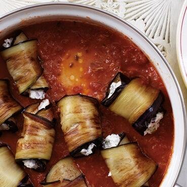 
                  
                    Ricotta-stuffed aubergines in a spiced tomato and spinach sauce
                  
                